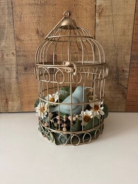 Decorative Gold Birdcage Accent with Blue Ceramic Bird on Nest with Greenery